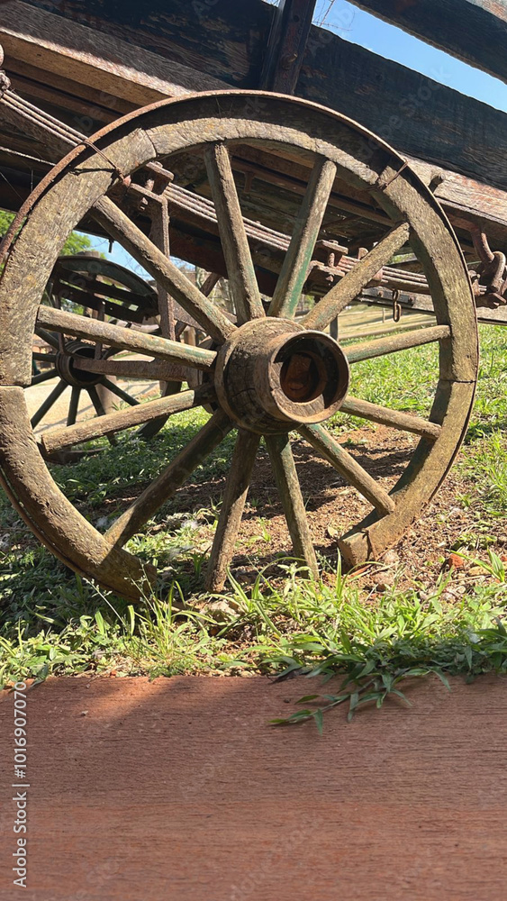 Old wagon wheel exposed outdoors. Old wagon wheel exposed outdoors.