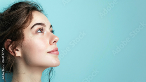 Side view young happy woman, close up, mock up area isolated on light blue background