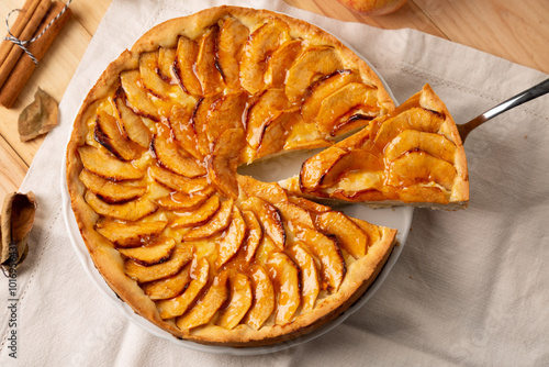 Delicious homemade traditional apple pie with pastry cream filling and jam cover