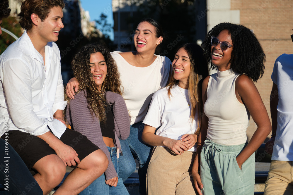 Multiracial friends are having fun together in the city on a sunny day