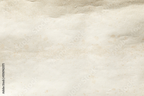 Old yellowed weathered paper with brown stains