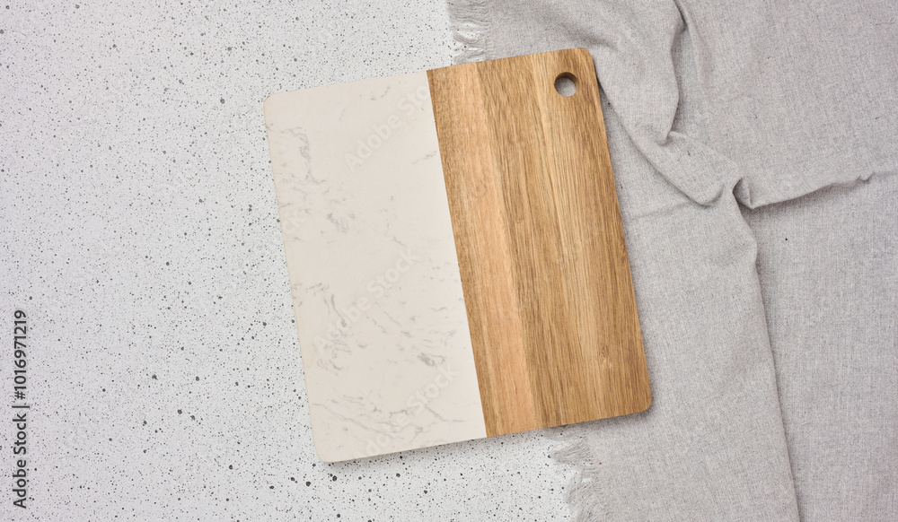 Fototapeta premium Empty wooden kitchen cutting board on a white background, top view