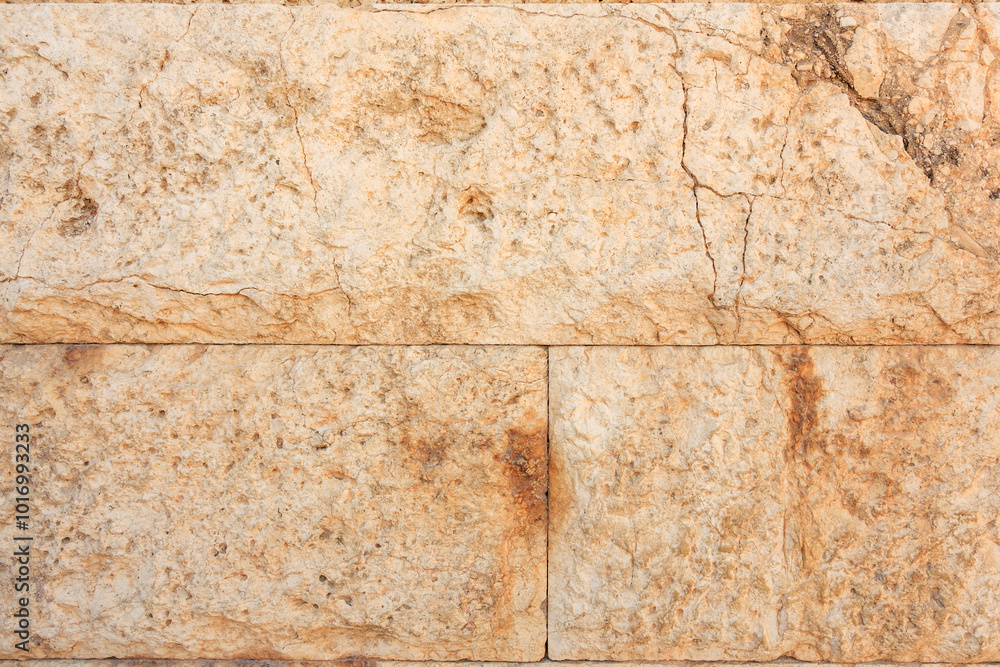 Fototapeta premium A wall with a rough, weathered texture