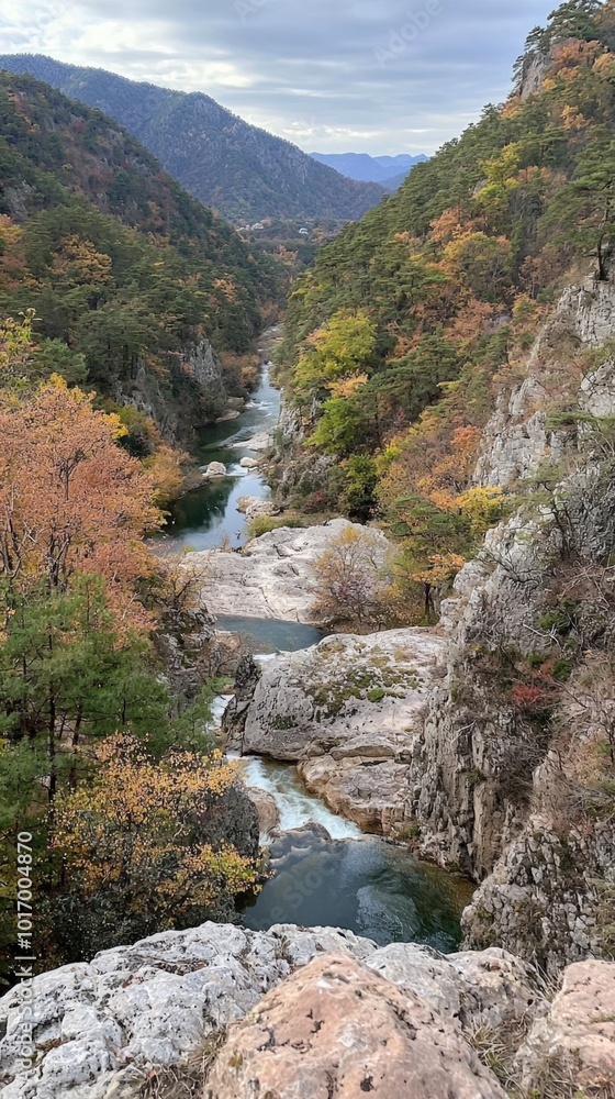 Serene autumn landscape with winding river and colorful foliage in a mountain valley Serene autumn landscape with winding river and colorful foliage in a mountain valley