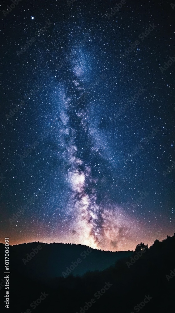 Stunning Milky Way galaxy captured in dark sky over isolated landscape at night Stunning Milky Way galaxy captured in dark sky over isolated landscape at night