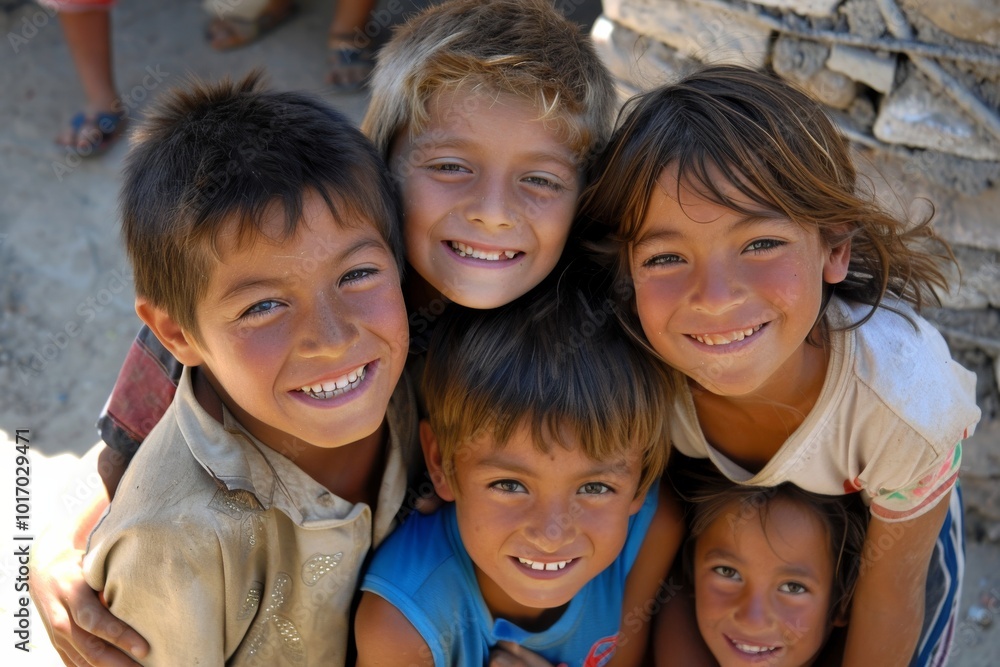 Group of happy children looking at camera with smiles on their faces. Group of happy children looking at camera with smiles on their faces.