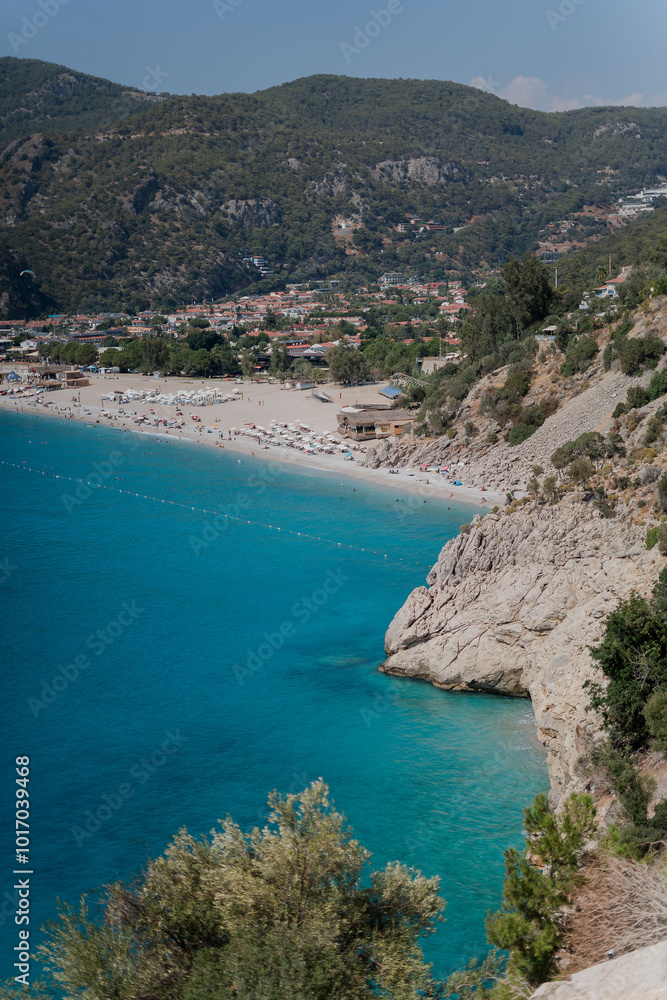 Fototapeta premium View of the beach with white sand and mountains