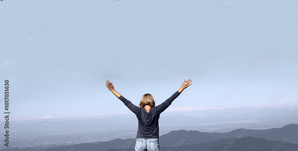 back rear view of one alone Happy mature woman traveler raised arms on top peak of mountain, feel freedom and enjoy nature. enjoying middle age female lady with arms raised up. Blue jeans. Bakhmaro. back rear view of one alone Happy mature woman traveler raised arms on top peak of mountain, feel freedom and enjoy nature. enjoying middle age female lady with arms raised up. Blue jeans. Bakhmaro.