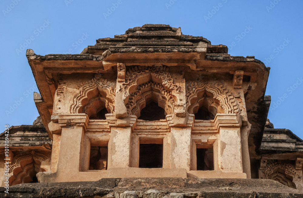 Lotus Mahal is an architectural masterpiece, a two-story structure with many open arches decorated with stucco lace. Hampi. India. Lotus Mahal is an architectural masterpiece, a two-story structure with many open arches decorated with stucco lace. Hampi. India.