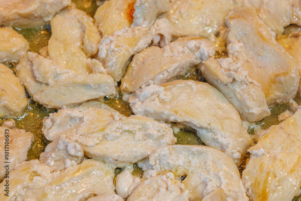 closeup full-frame background of roasting chicken breast white meat closeup full-frame background of roasting chicken breast white meat