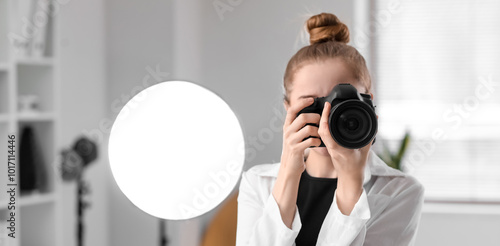 Young female photographer w...