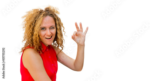 Obraz na płótnie Beautiful fashionable businesswoman smiling making and showing ok hand sign fingers winking with one eye w salonie