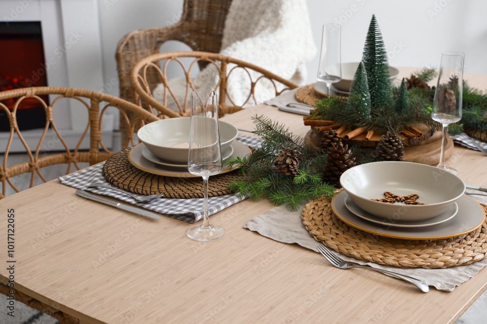 Christmas table setting with fir branches and pine cones Christmas table setting with fir branches and pine cones