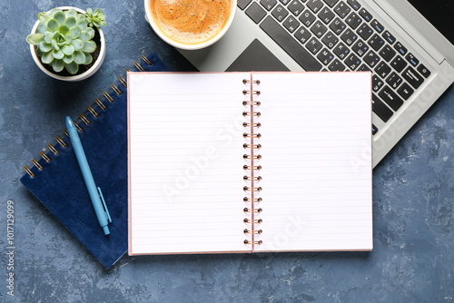 Notebooks with laptop and c...