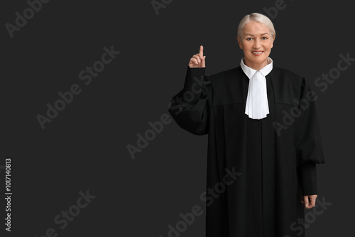Mature female judge pointin...