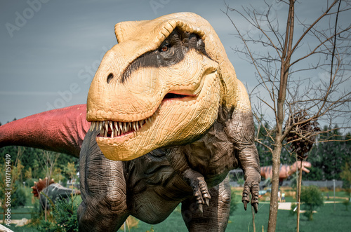 T-rex with tree branches against on the nature