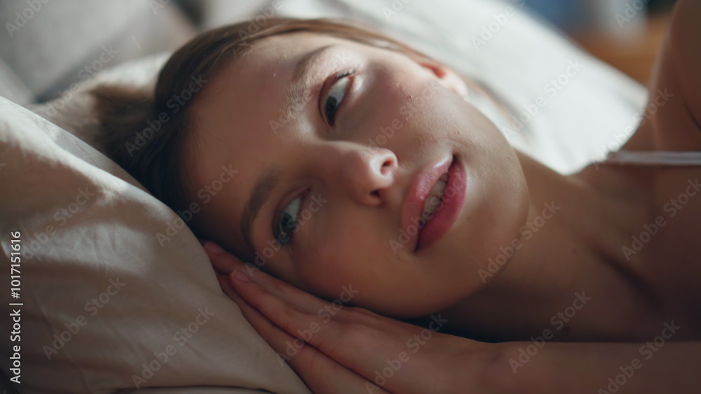 Closeup calm woman wakeup lying in bed early morning. Brunette taking smartphone Closeup calm woman wakeup lying in bed early morning. Brunette taking smartphone