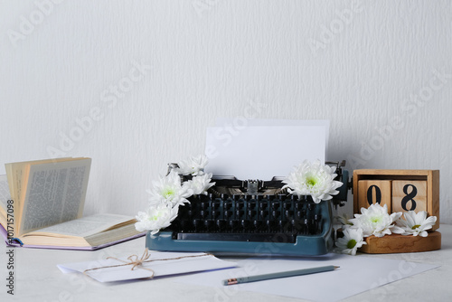 Vintage typewriter with pap...