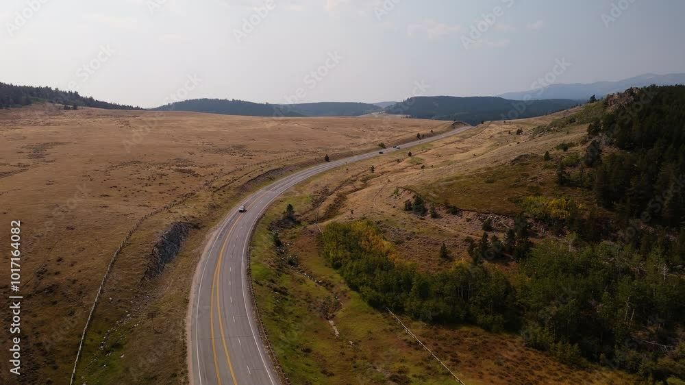 Drone view of a highway through mountains in USA. Drone view of a highway through mountains in USA.