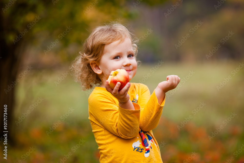 Cute little girls eating red delicious apple Cute little girls eating red delicious apple