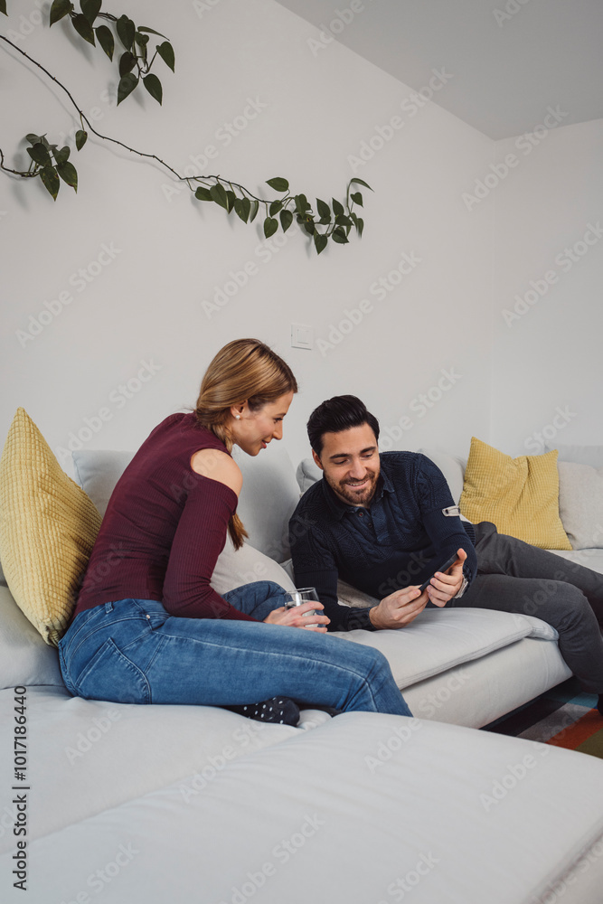 The couple go about their daily chores in the apartment. The couple talks in the kitchen, sits on the sofa, at the dining table. The couple go about their daily chores in the apartment. The couple talks in the kitchen, sits on the sofa, at the dining table.