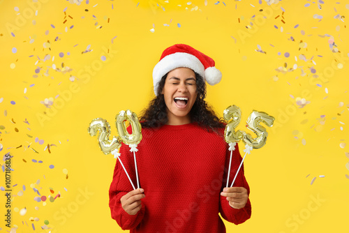Happy young woman in Santa ...