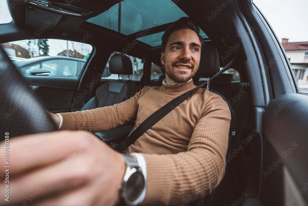 A business man prepares to drive his car around the city A business man prepares to drive his car around the city