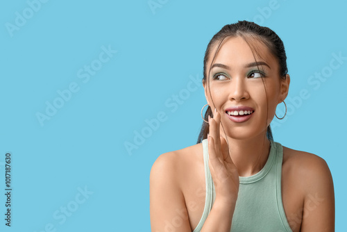 Smiling young asian woman l...