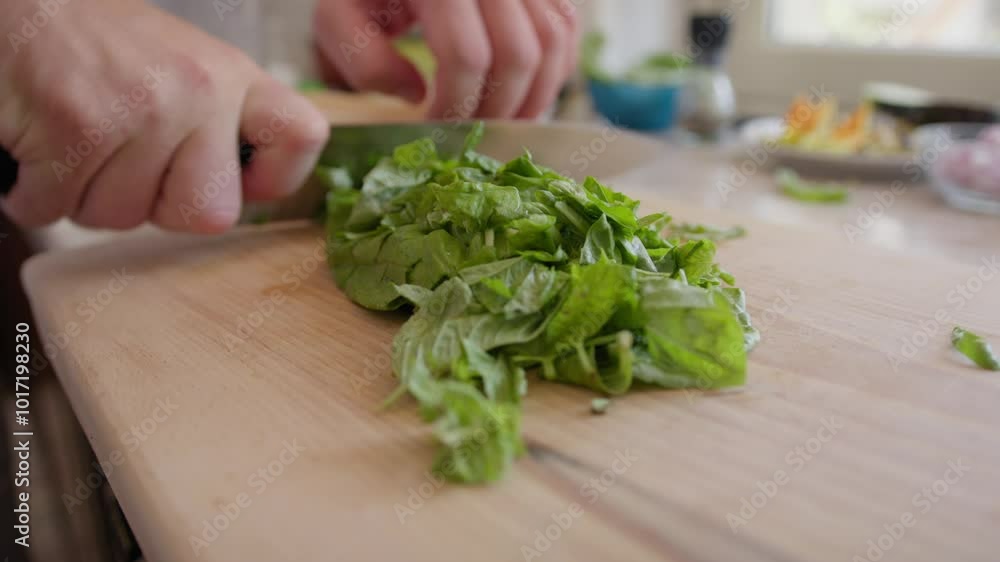 Chef Is Cutting Basil Leaves On A Wooden Cutting Board Chef Is Cutting Basil Leaves On A Wooden Cutting Board