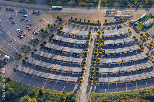 Aerial view of UK park and ride with solar roof panels, promoting sustainable urban transit solutions.