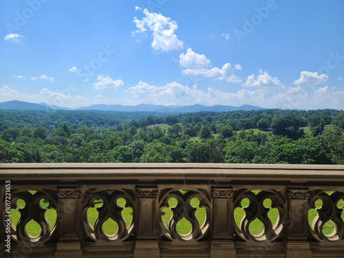 Scenic Balcony View of Green Hills and Mountains