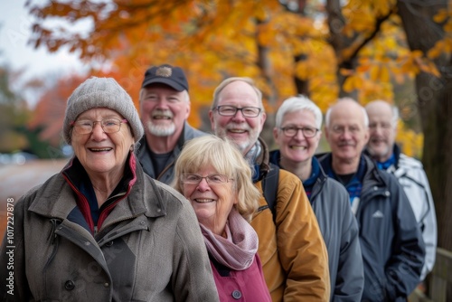 Group of senior friends having fun in the park on an autumn day