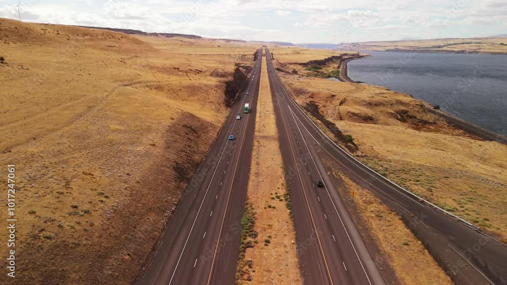 Straight highway through brown fields by the river. Straight highway through brown fields by the river.
