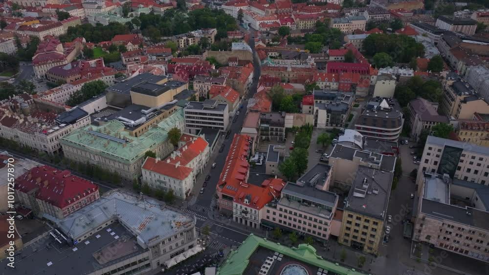 Aerial view of the streets of Vilnius, Lithuania. Cars are driving along the road and people are walking on the sidewalks