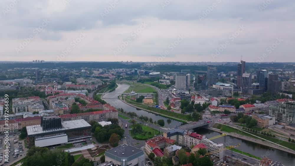 Aerial view of Vilnius city center with Neris River crossing. Residential, commercial and industrial buildings are present Aerial view of Vilnius city center with Neris River crossing. Residential, commercial and industrial buildings are present