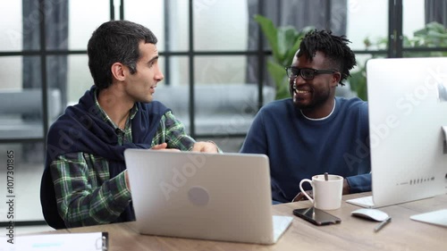 Young multiethnic businessmen working at the negotiating table