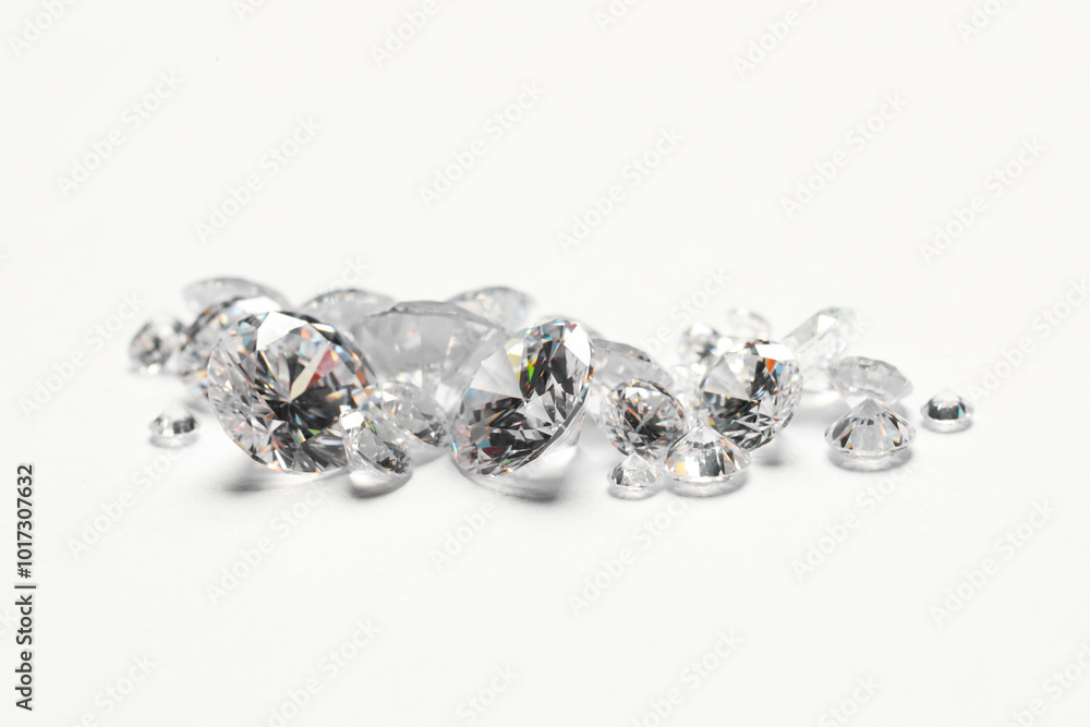 Many beautiful shiny diamonds on white background, closeup Many beautiful shiny diamonds on white background, closeup