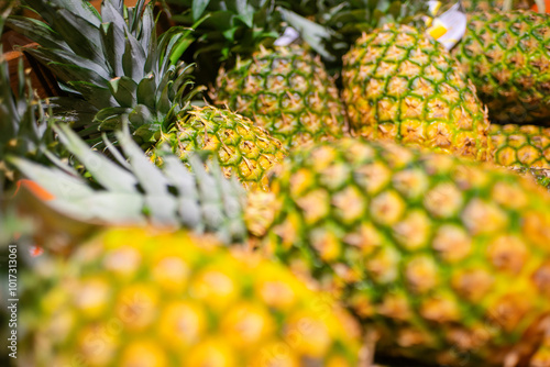 Pineapples on display at the grocery store
