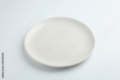 One empty ceramic plate isolated on white