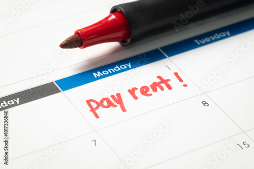 Pay rent reminder written on calendar