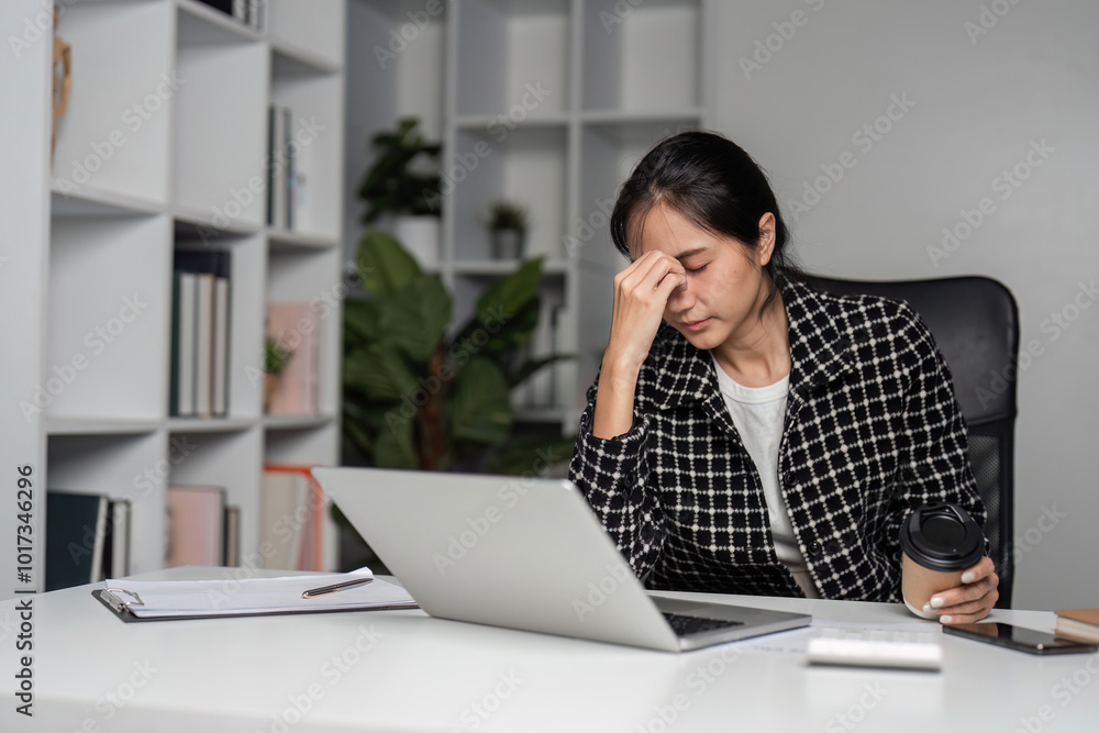 Stressed Business Woman Working from Home, Experiencing Exhaustion and Burnout in Modern Office Setting Stressed Business Woman Working from Home, Experiencing Exhaustion and Burnout in Modern Office Setting