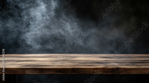 Wooden table with smoke on dark background for product display