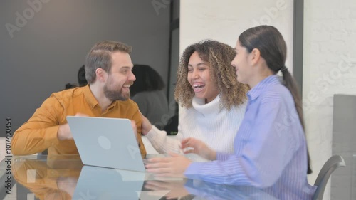 Excited Business People Celebrating Success in Office
