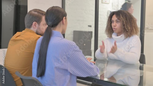 Female African Therapist Talking with Mixed Race Couple