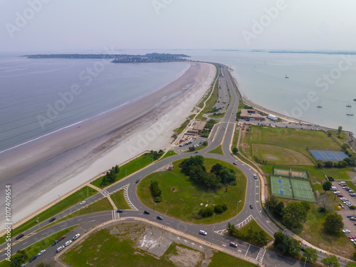 Nahant Long Beach and Nahant Road aerial view at Massachusetts Bay, with Boston modern city at the background, in town of Nahant, Essex County, Massachusetts MA, USA.  photo