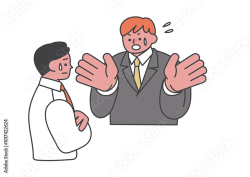 言い訳をしている男性会社員