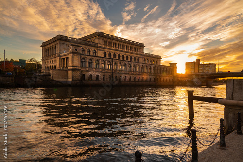 Obraz na płótnie Building of Koenigsberg stock exchange on Pregola river at sunset. Kaliningrad. Russia w salonie