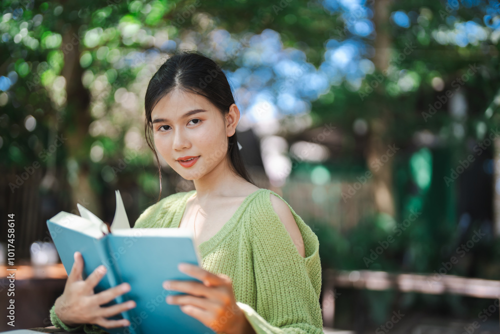 Beautiful asian young woman reading book education or learning on campus portrait outdoor happiness at university park Beautiful asian young woman reading book education or learning on campus portrait outdoor happiness at university park