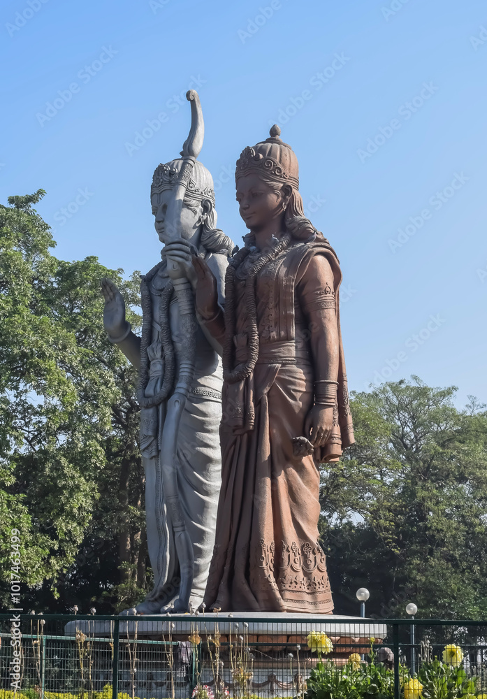 Fototapeta premium Big statue of Lord Sita Ram near Delhi International airport, Delhi, India, Lord Ram and Sita big statue touching sky at main highway Mahipalpur, Delhi
