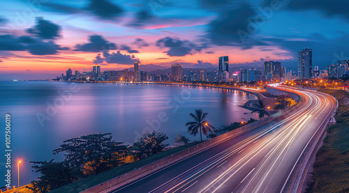 Highway with city skyline and sea view, a panoramic photo of an empty highway road at sunset with blurred light trails over an island cityscape overlooking the ocean in the background.